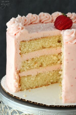 Strawberry Moscato Layer Cake with a slice removed