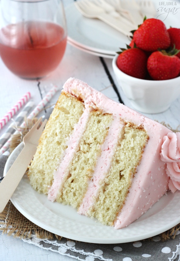 Strawberry Moscato Layer Cake slice on a plate