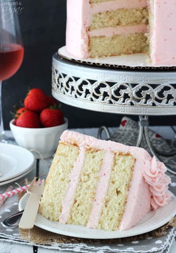 Strawberry Moscato Layer Cake slice on a plate