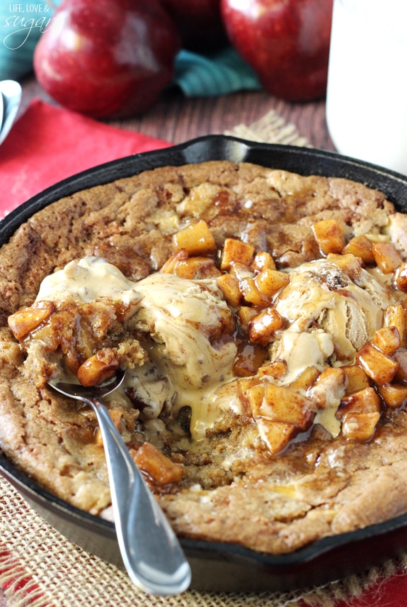 Apple Cinnamon Skillet Blondie topped with ice cream and a spoon