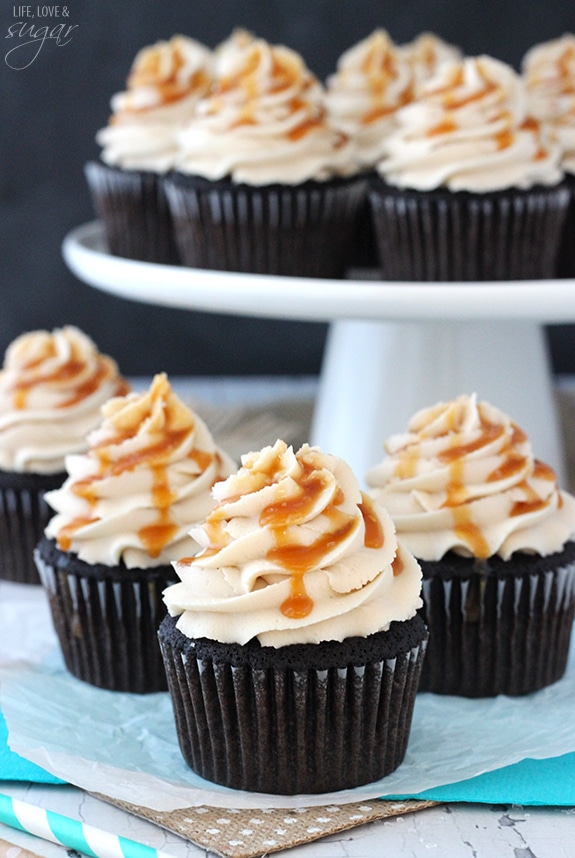 Kahlua Chocolate Cupcakes with a Salted Caramel Drizzle on a cake stand and in front of it