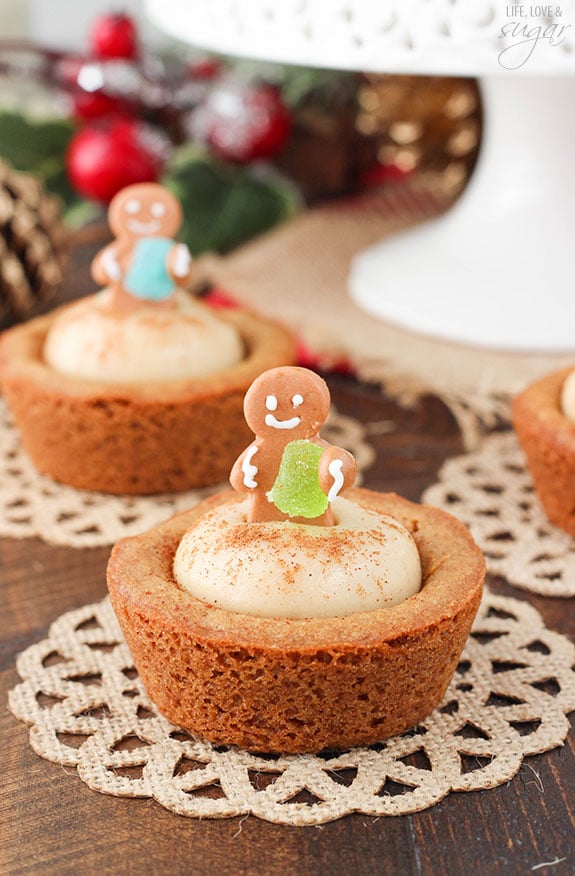 Gingerbread Cheesecake Cookie Cups topped with mini gingerbread cookies