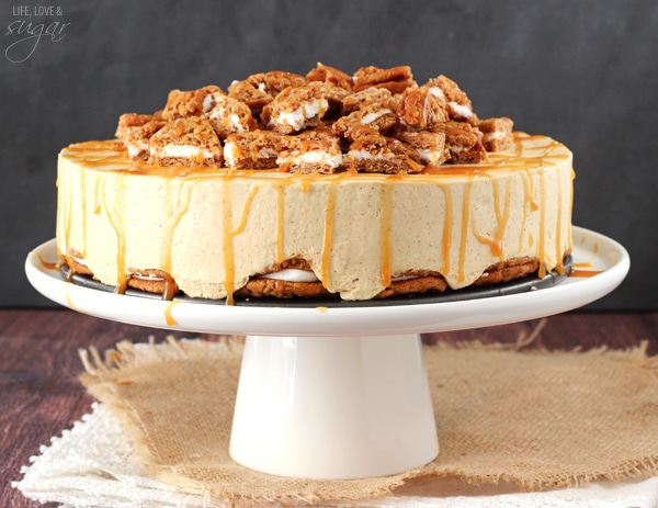 No Bake Oatmeal Cream Pie Cheesecake on a white cake stand