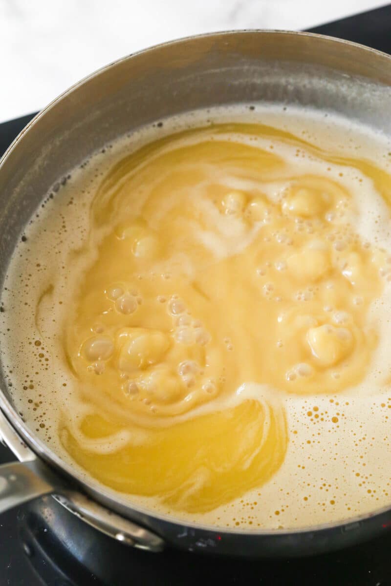 stage one of the caramel making process with the caramel in a saucepan