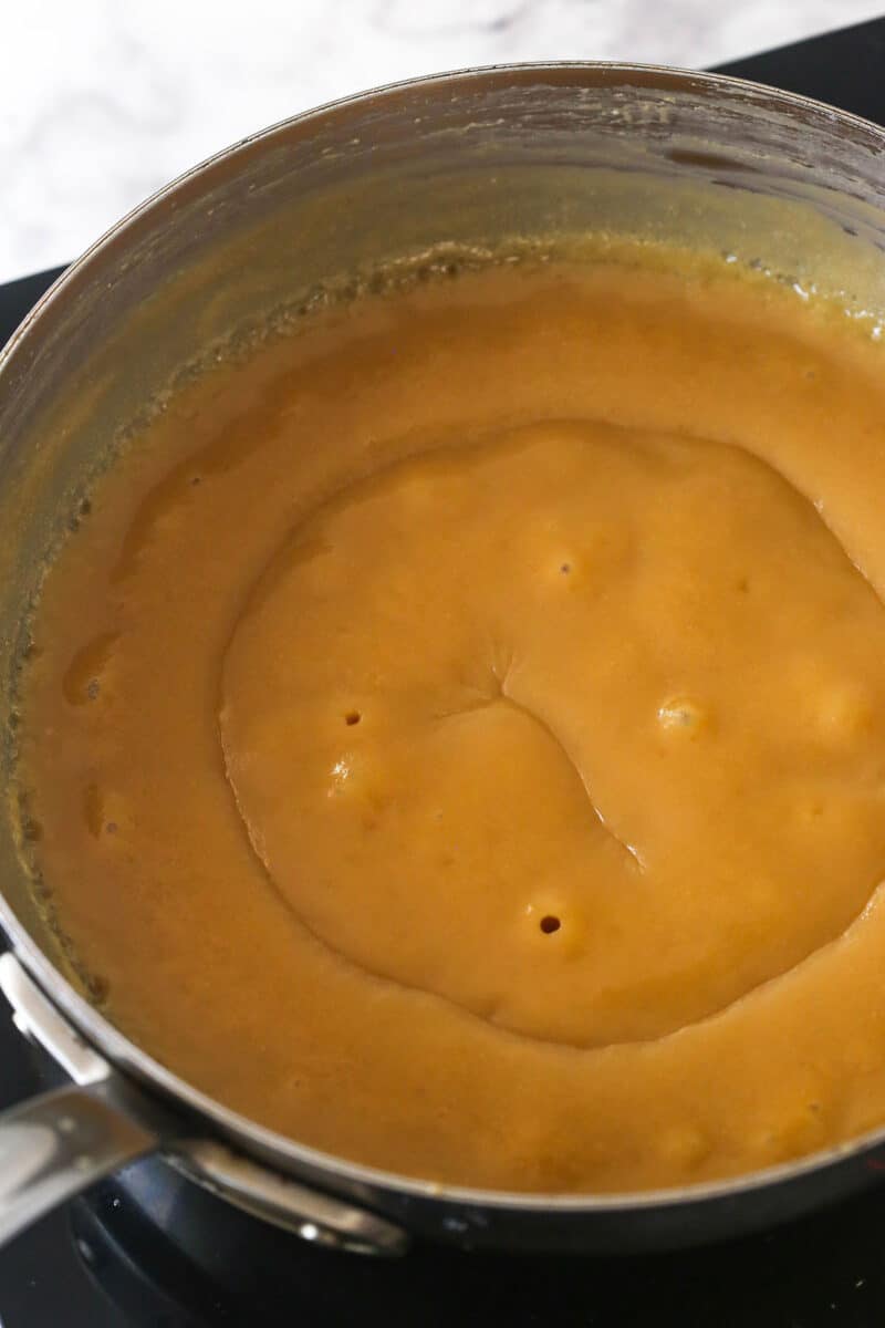 stage 4 of making the caramel, the bubbles are subsiding and the mixture is thick