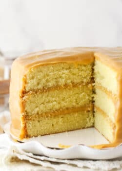 caramel cake with a couple slices cut out