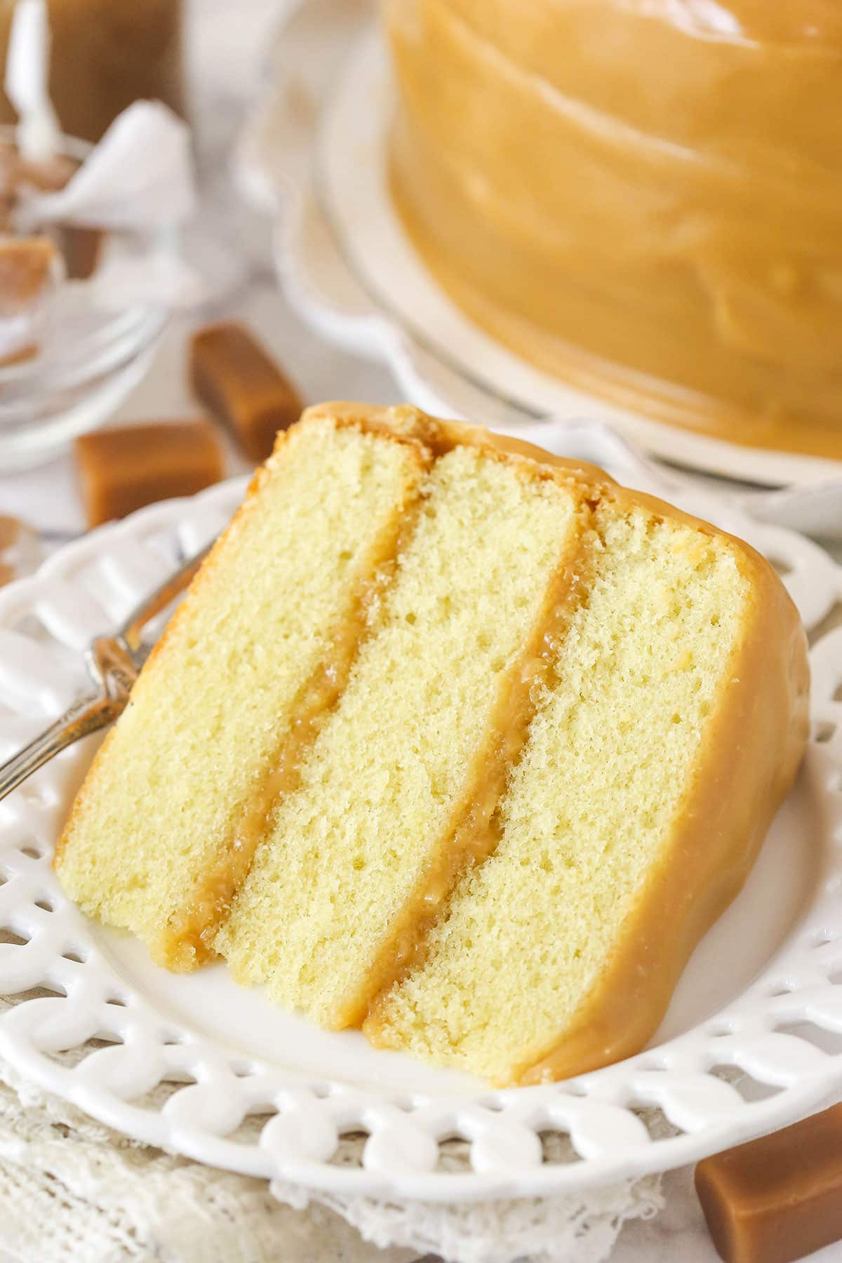 slice of caramel cake on a white plate