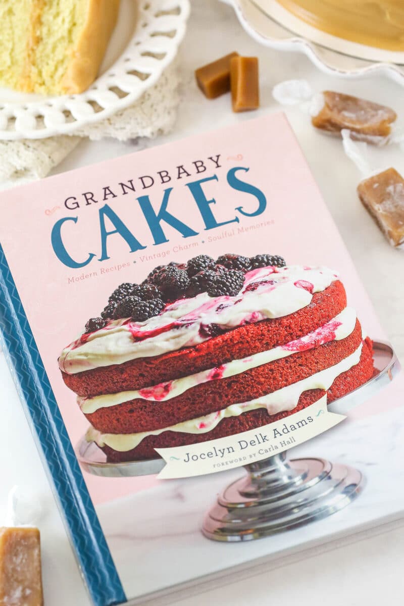 grandbaby cakes cookbook with cake and caramels around it