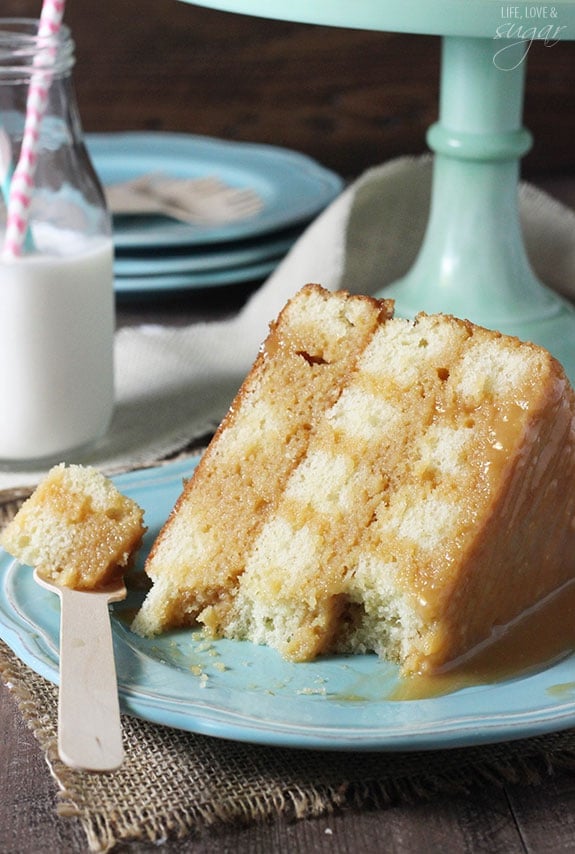 A slice of cake on its side with a forkful taken out.