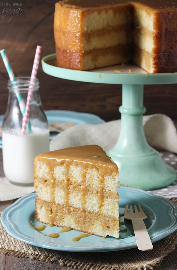 A slice of homemade caramel cake on a blue plate