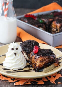 Two Chocolate Sticky Buns with gummy worms and a whipped cream ghost