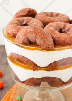 Close-up view of Pumpkin Spice Donut Cheesecake Trifle in a trifle bowl