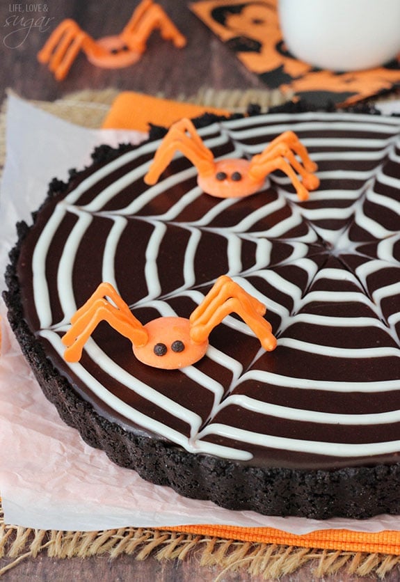 Spiderweb Chocolate Tart topped with orange candy spiders