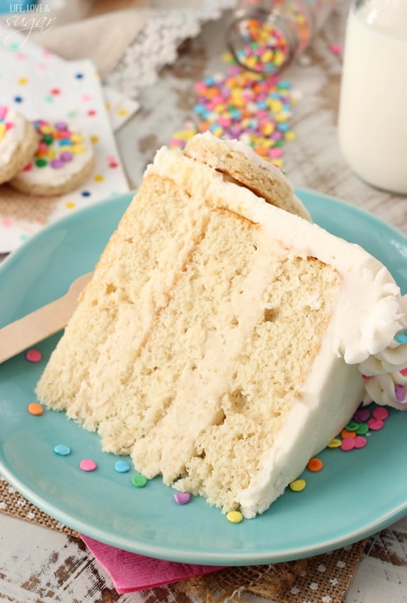 BAILEYS Frosted Vanilla Cookie Layer Cake slice on a blue plate