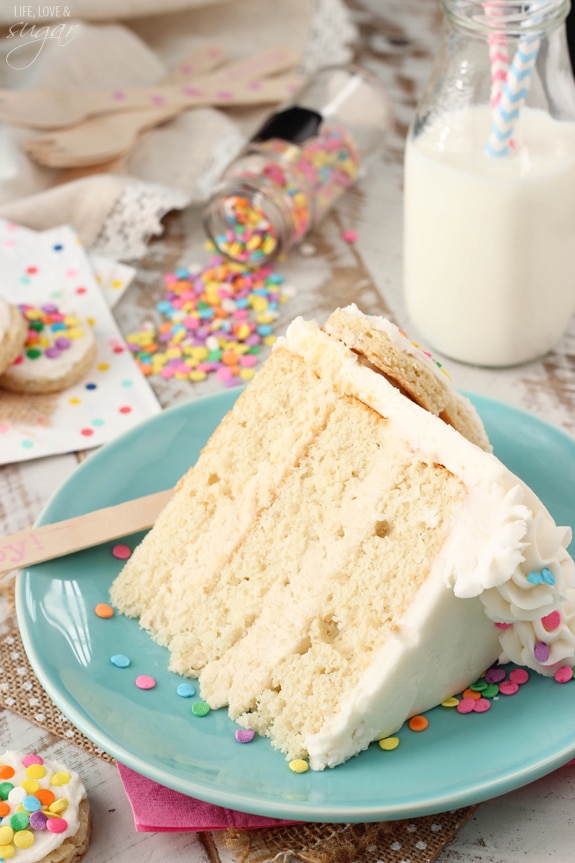 BAILEYS Frosted Vanilla Cookie Layer Cake slice on a blue plate