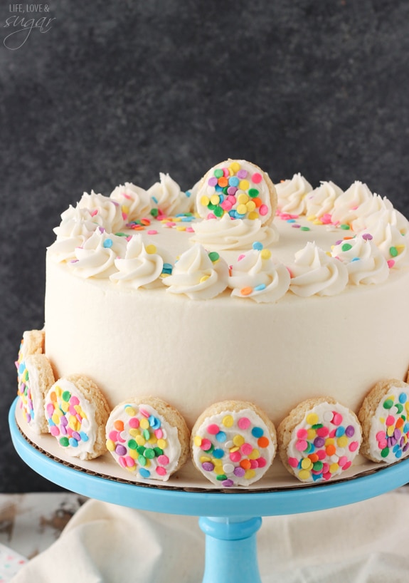 BAILEYS Frosted Vanilla Cookie Layer Cake on a blue cake stand