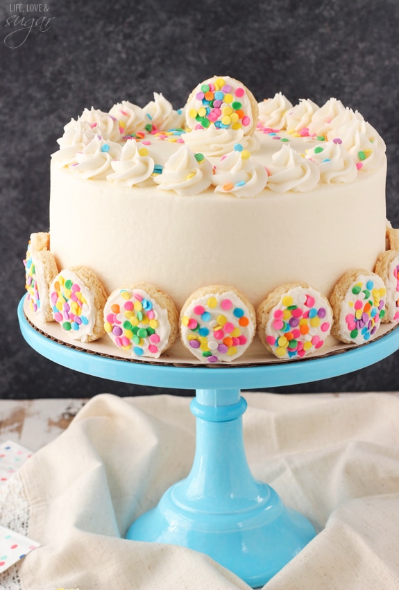 BAILEYS Frosted Vanilla Cookie Layer Cake on a blue cake stand