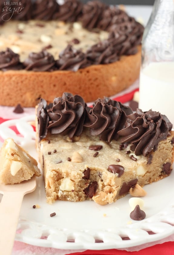 Triple Chocolate Chip Cookie Cake slice on a plate with a bite on a fork