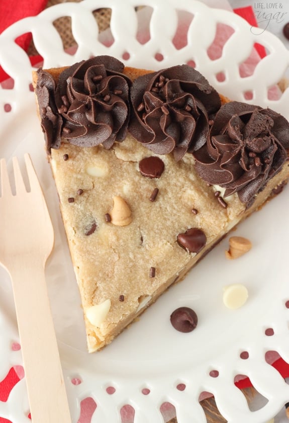 Overhead view of a slice of Triple Chocolate Chip Cookie Cake on a white plate