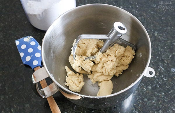 Bowl with sugar cookie dough and spatula