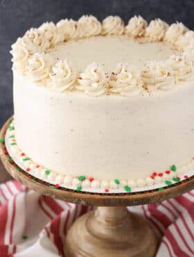 Eggnog Layer Cake on wooden stand close up