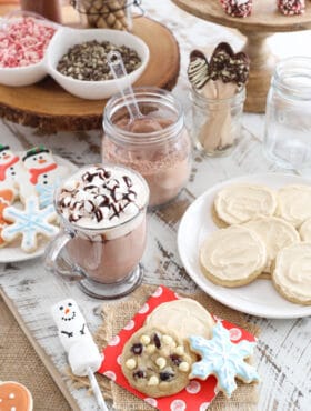 hot chocolate bar featuring white chocolate cranberry cookies and maple iced cookies