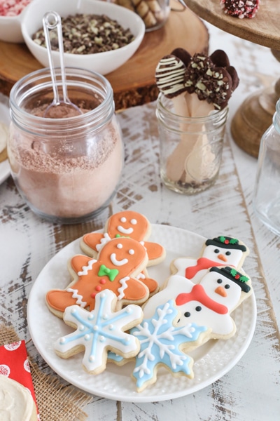 cutout sugar cookies on a plate - snowflakes, snowmen and gingerbread men