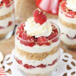 close up of Raspberry Amaretto Cheesecake Trifle in a glass