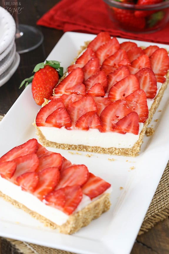 Strawberry Champagne Tart slices on a white platter