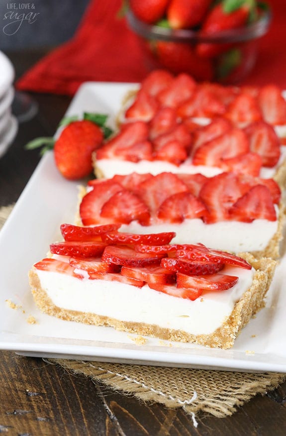 Strawberry Champagne Tart slices on a white platter