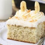 Banana Cake with Cream Cheese Frosting slice on white plate