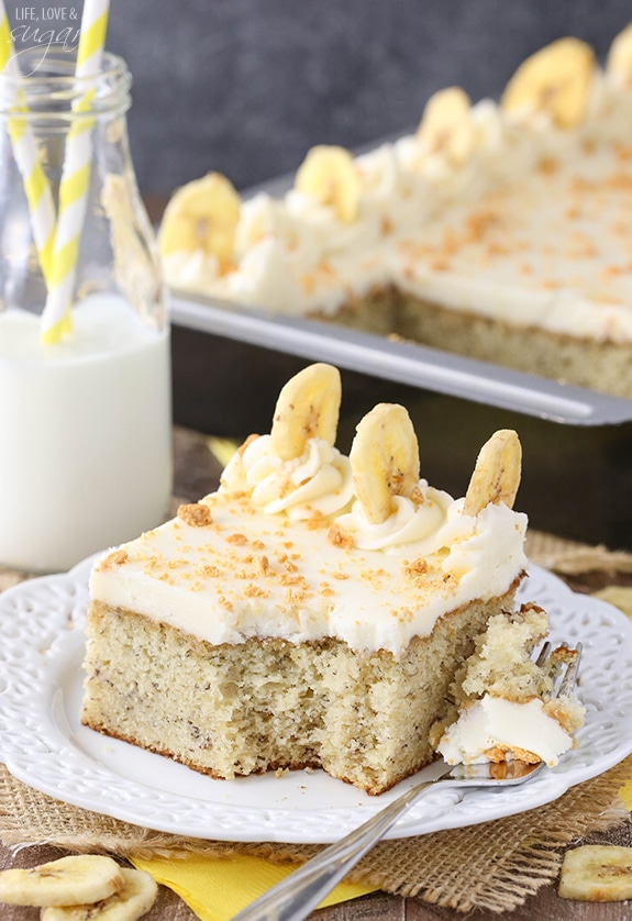 Banana Cake with Cream Cheese Frosting slice on a plate with a bite on a fork