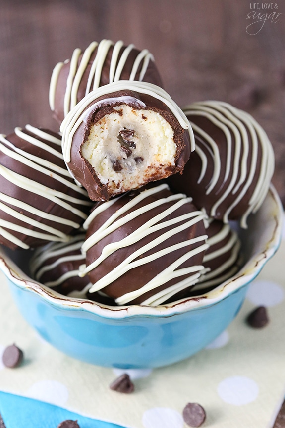 Chocolate Chip Cookie Dough Cheesecake Balls - eggless cookie dough surrounded by vanilla cheesecake! All dipped in chocolate! So good!