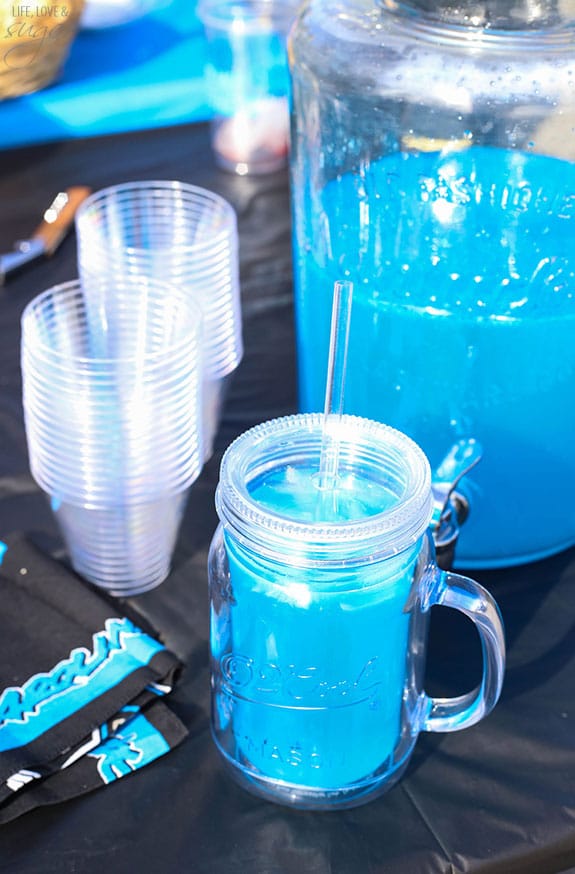 Carolina Panther Punch in a beverage dispenser with a full glass in front