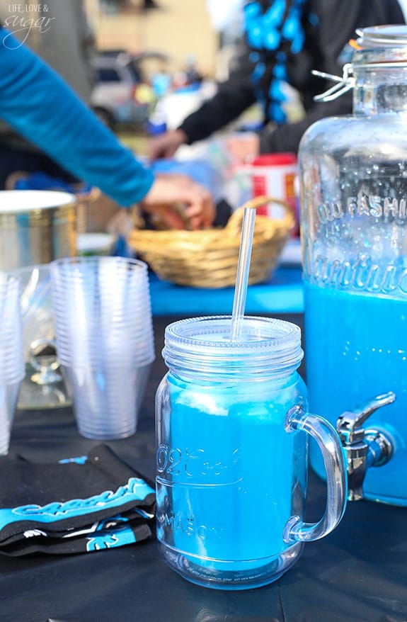 Carolina Panther Punch in a beverage dispenser with a full glass in front