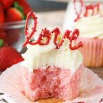 image of Strawberry Cupcake with Cream Cheese Frosting with bite taken out