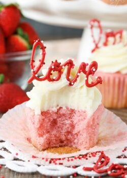 image of Strawberry Cupcake with Cream Cheese Frosting with bite taken out