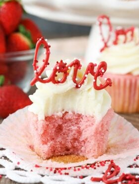 image of Strawberry Cupcake with Cream Cheese Frosting with bite taken out