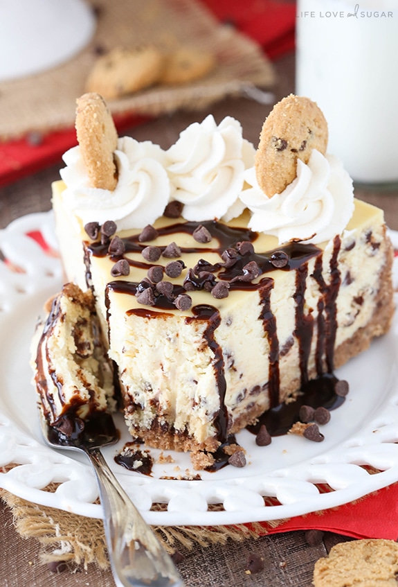 Chocolate Chip Shortbread Cheesecake slice on a plate with a bite on a fork