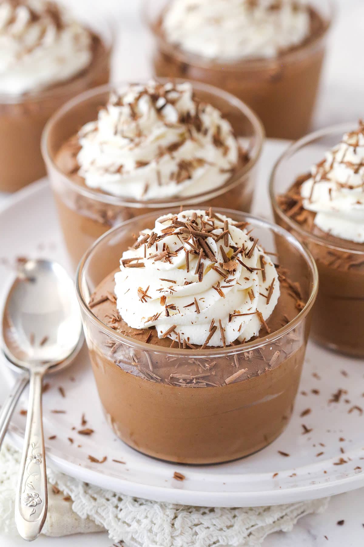 Chocolate mousse cups topped with whipped cream