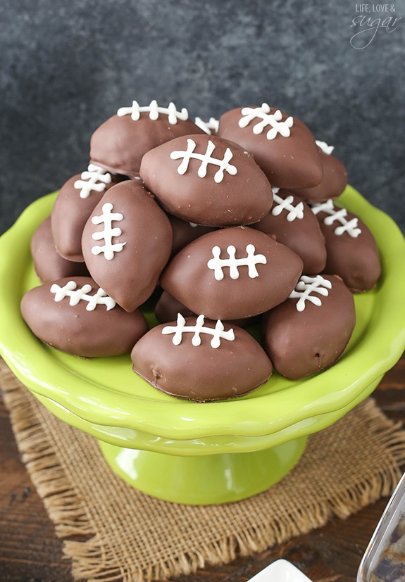 Chocolate cookie dough footballs in a green bowl