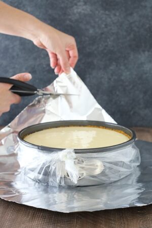 image of springform pan in plastic liner and foil