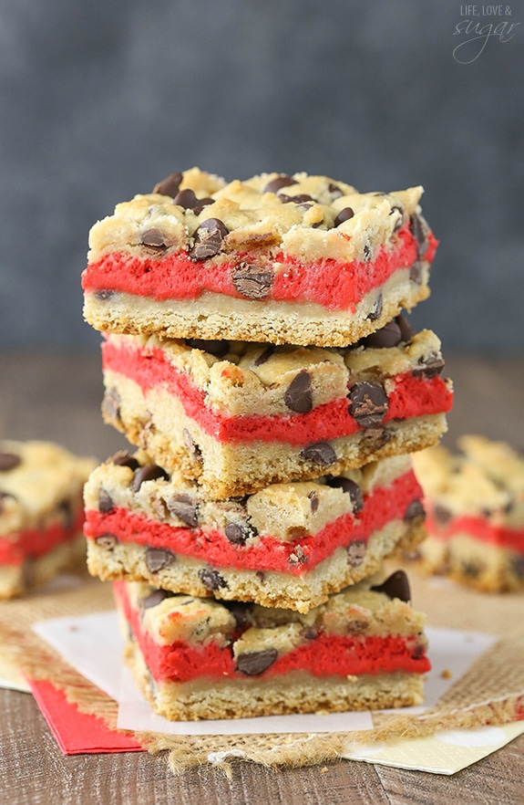 Red Velvet Cheesecake Chocolate Chip Cookie Bars - Chewy chocolate chip cookie surrounds red velvet cheesecake! Easy to make and great for Valentines Day!