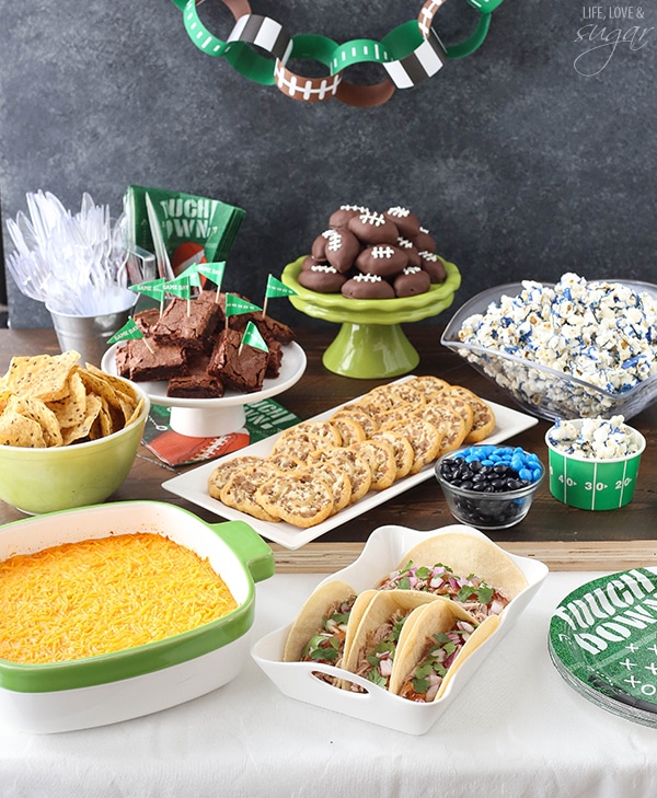 A table of foods set up for a Super Bowl Party 