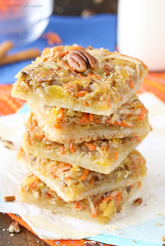 Carrot Cake Shortbread Bars stacked on a napkin