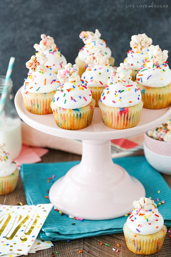 Funfetti Popcorn Marshmallow Treat Cupcakes on pink stand