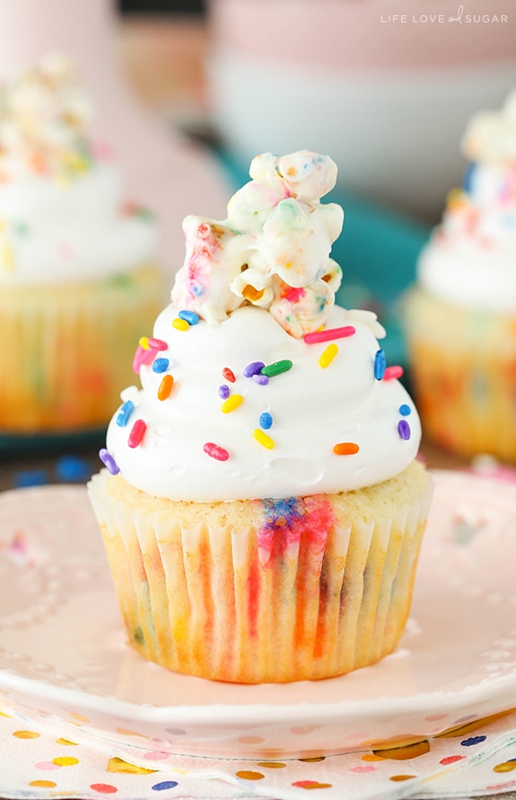 A Funfetti Popcorn Marshmallow Treat Cupcake on a plate