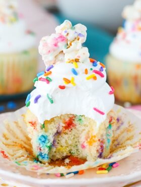 Funfetti Popcorn Marshmallow Treat Cupcake with a bite taken out