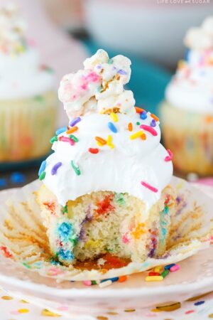 Funfetti Popcorn Marshmallow Treat Cupcake with a bite taken out