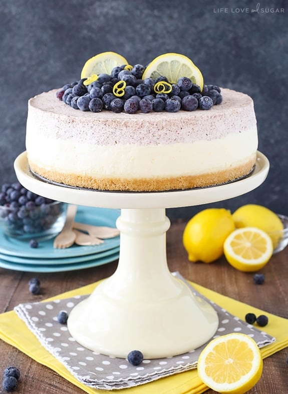 Lemon Blueberry Mousse Cake on a white cake stand